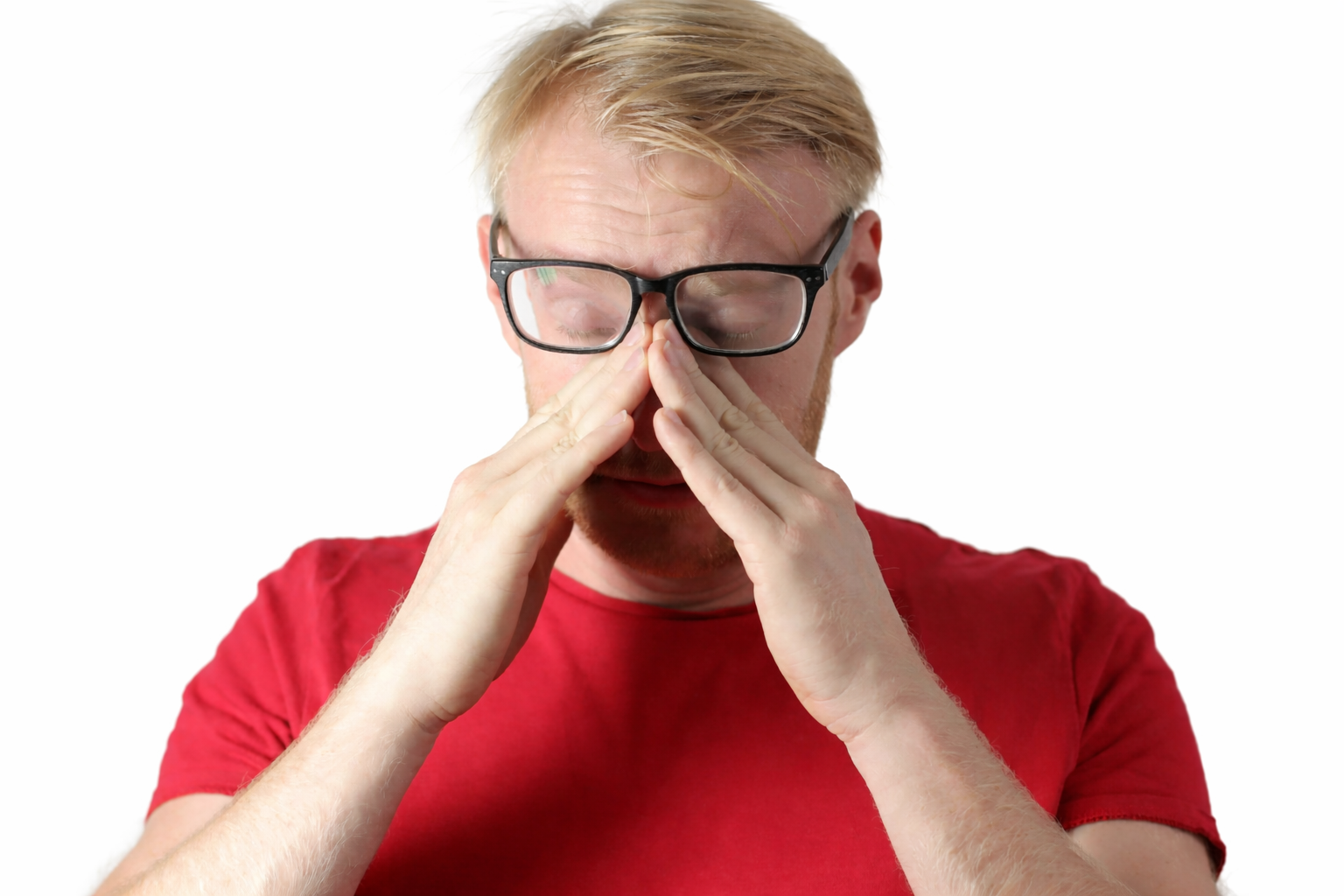 Man rubbing dry eyes